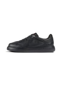 Black leather sneakers with textured finish, round toe, and six eyelet lacing. Features a thick, black rubber sole and minimal branding.