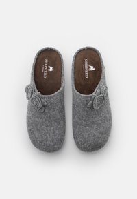Gray wool clogs with floral accents. Soft texture, rounded toe, open back design, and brown inner lining. Logo visible on insole.