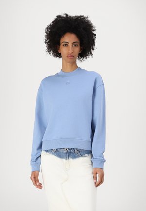 Sweatshirt bleu clair en mélange de coton. Doté d'un col rond, de longues manches et de poignets côtelés. Détail brodé sur la poitrine.