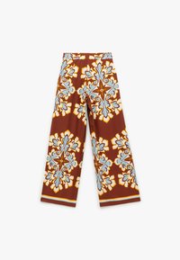 Bredde benbukser i et brunt stof med et stort blomsterprint i blå og orange nuancer. Elastisk talje, glat tekstur.