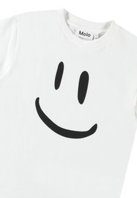 Hvit bomulls t-skjorte med et stort svart smilefjesmotiv, rund hals og korte ermer. Myk tekstur og uformell design.