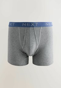 Bóxer de algodón gris con una cinturilla elástica azul que presenta el texto repetido "NEXT", diseñado para comodidad y un ajuste ceñido.