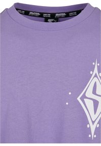 Purple cotton t-shirt featuring a white geometric graphic design and small dotted accents on the front. Classic crew neckline and soft texture.