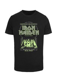 Tricou negru din bumbac cu un print grafic verde. Designul include "Iron Maiden," "World Slavery Tour 1985," și un motiv egiptean.