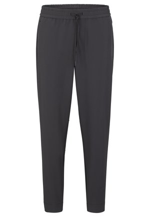 Pantalon de jogging gris foncé en matériau doux avec une taille élastique et un cordon de serrage, comportant des chevilles côtelées et des poches latérales.