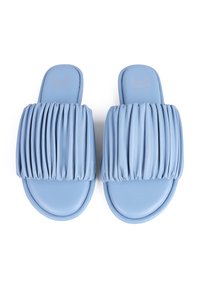Blue leather slide sandals featuring a textured, pleated strap with a smooth footbed. Rounded toe, minimalistic design with no hardware.