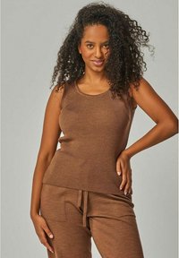 Brown ribbed tank top with a round neckline, paired with matching brown pants. Fabric appears soft and textured.
