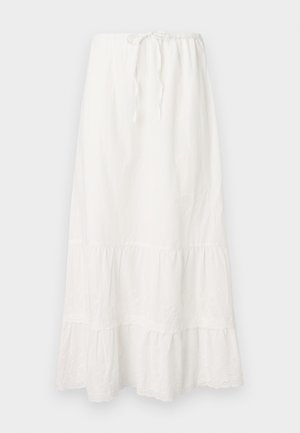 Hosszú fehér pamut szoknya rugalmas derékkal és állítható zsinórral. Réteges kialakítás jellemzi, finom csipke díszítéssel az alján.