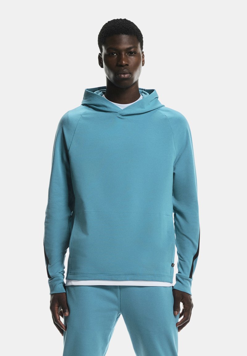 Light blue hoodie made of soft fabric with a hood, long sleeves, and a slim fit. Features black accents on the sleeves and a kangaroo pocket.