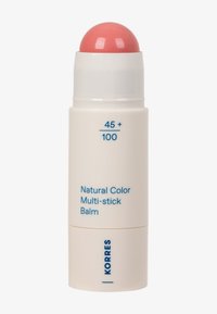 Balm multi-usage de couleur naturelle dans un tube cylindrique blanc avec un embout de baume rose arrondi et un texte bleu à l'avant.