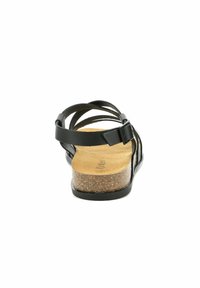 Sandales en cuir noir avec plusieurs sangles, semelle en liège et talon plat. L'arrière présente une boucle réglable pour un ajustement optimal.