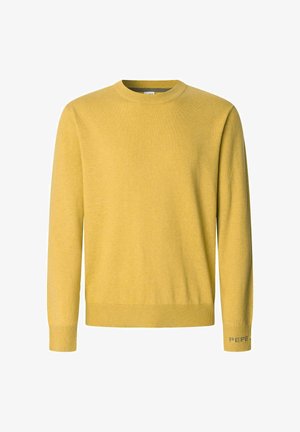 Geltona megztinė su apvaliu iškirpimu, ilgomis rankovėmis, raukiniais ant rankovių ir apačios, su tekstu "PEPE" mėlyna spalva ant kairiojo rankovės.