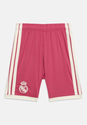 Short de sport rose avec des bandes blanches sur les côtés et logo du Real Madrid sur la partie inférieure de la jambe gauche, taille élastique et ourlets blancs.