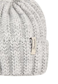 Gray knitted beanie with vertical ribbing pattern. Features a soft texture and a small labeled tag in an off-white color.