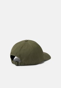 Olive green baseball cap made of soft fabric. Curved brim, adjustable strap at the back, six-panel design with stitched ventilation holes.