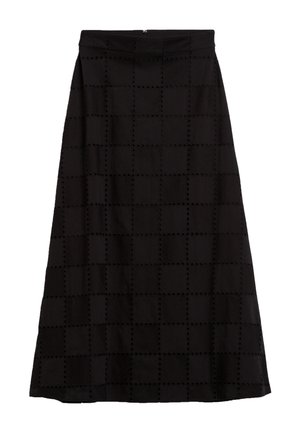 Jupe maxi noire avec un motif à carreaux texturé et des découpes circulaires. Présente une taille ajustée et une fermeture éclair à l'arrière.