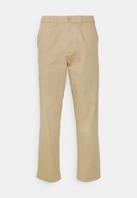 Pantalon en coton beige avec une coupe droite, fermeture avant par boutons et passants pour ceinture. Texture lisse sans motifs ni accents visibles.