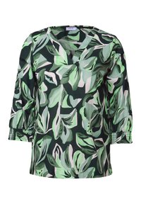Haut à motifs floraux avec des motifs de feuilles vertes et blanches. Présente un col en V et des manches bouffantes trois-quarts avec des poignets froncés.