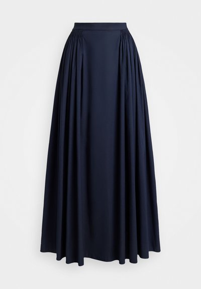 Garšs tumši zils svārki ar savilktiem pleciem tuvāk jostas vietai un plašu plūstošu apakšmalu.