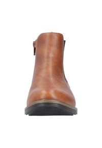 Botte de cheville en cuir marron avec une fermeture éclair sur le côté, bout rond et semelle en caoutchouc texturée, offrant une finition lisse et des détails de couture minimaux.