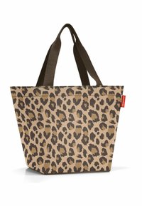 Leopard-print tote bag made of durable fabric, featuring a tapered design, dark brown handles, and a light tan background with black accents.