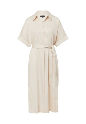 Beige shirtjurk met een geknoopte halslijn, korte opgerolde mouwen, een voorknopsluiting en een tailleband. Gladde stof met zijzakken.