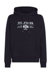 Sudadera de color azul marino hecha de algodón, con un bolsillo frontal tipo canguro, cordones ajustables y texto de logo blanco en el pecho.