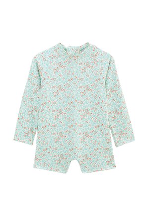 Combinaison légère bleu clair à motif floral avec manches longues, tissu doux, fermeture à pression au niveau du cou et jambes courtes. Présente de petits accents floraux.