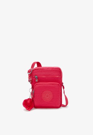 Rode nylon schoudertas met verstelbare band, twee ritssluitingen en een ronde logo badge. Inclusief een fluffy aap sleutelhanger.