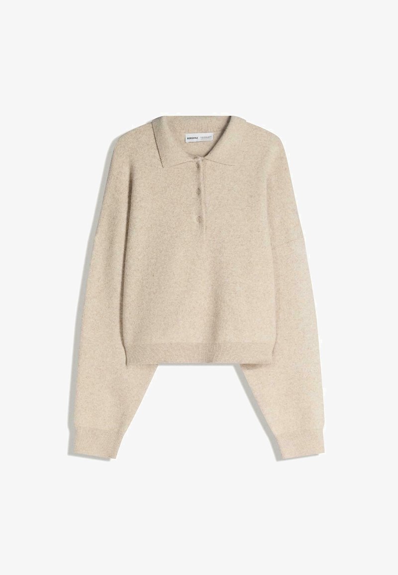 Pullover cropped in misto lana beige con colletto, tre bottoni e maniche lunghe con polsini e orlo a coste. Texture liscia.