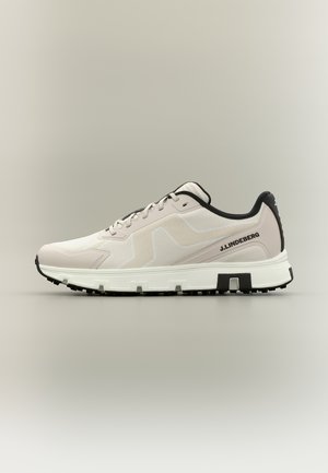 Light beige sneaker with black trim, white sole with grip tread, lace-up closure, and "J.LINDEBERG" branding on the side.