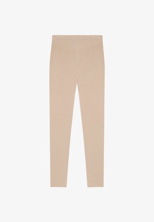 Beige Leggings aus weichem Stoff, mit glatter Textur, enganliegendem Design und elastischem Bund, ohne sichtbare Nähte oder Muster.