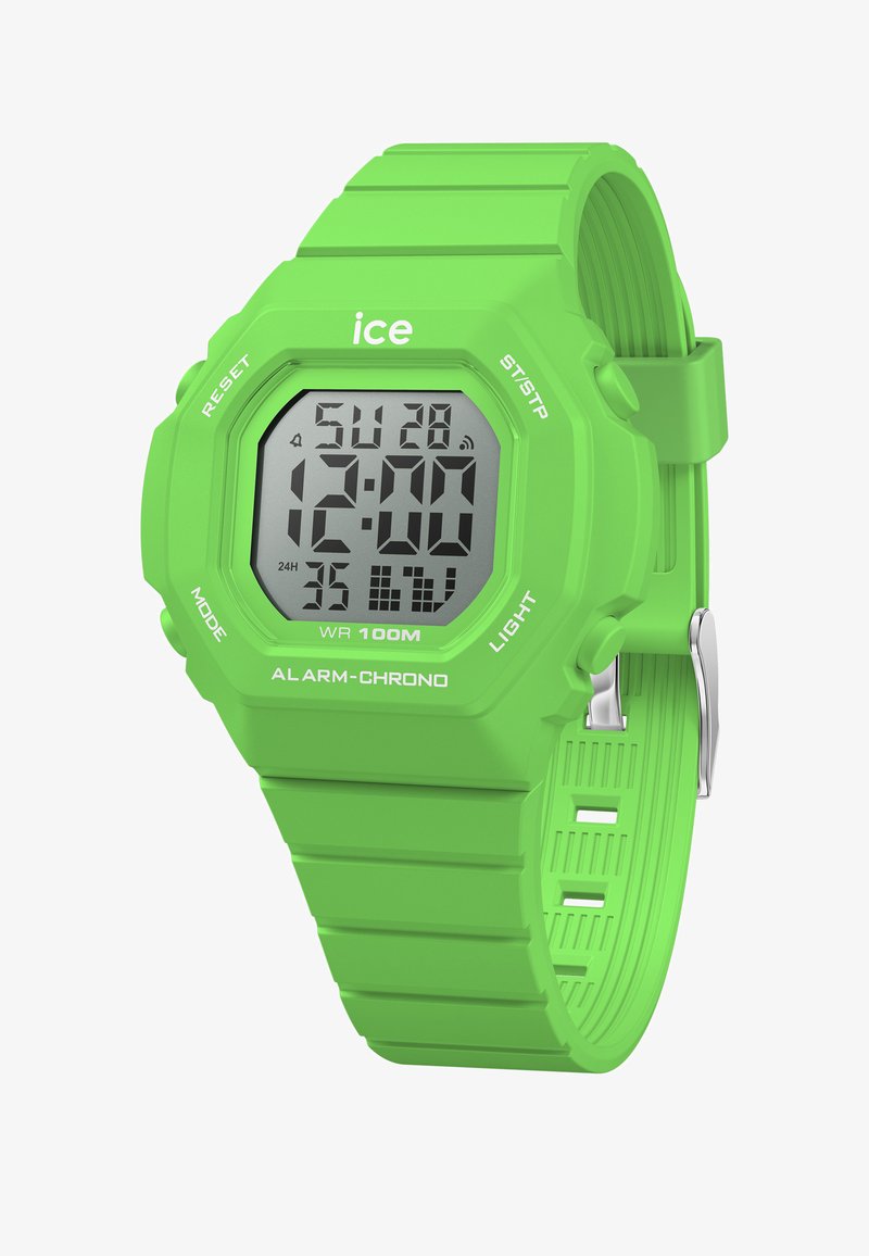 Zelen digitalni ura s pravokotnim zaslonom, silikonskim trakom in več gumbi. Značilnosti vključujejo prikaz datuma, vodoodpornost do 100 m.