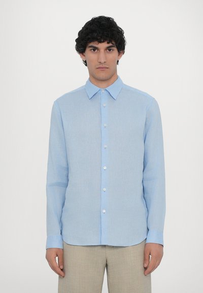 Light blue dress shirt made of a smooth, lightweight fabric. Features a button-up front, classic collar, and long sleeves.