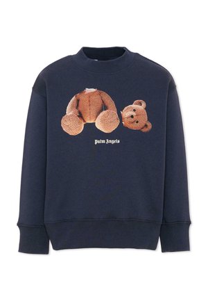 Granatowa bluza z grafiką misia rozdzielonego na głowę i ciało nad tekstem "Palm Angels" w białej gotyckiej czcionce.