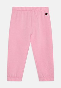 Leggings de algodón rosa con una cinturilla elástica. El diseño presenta piernas ajustadas y un pequeño logo en la parte superior izquierda.