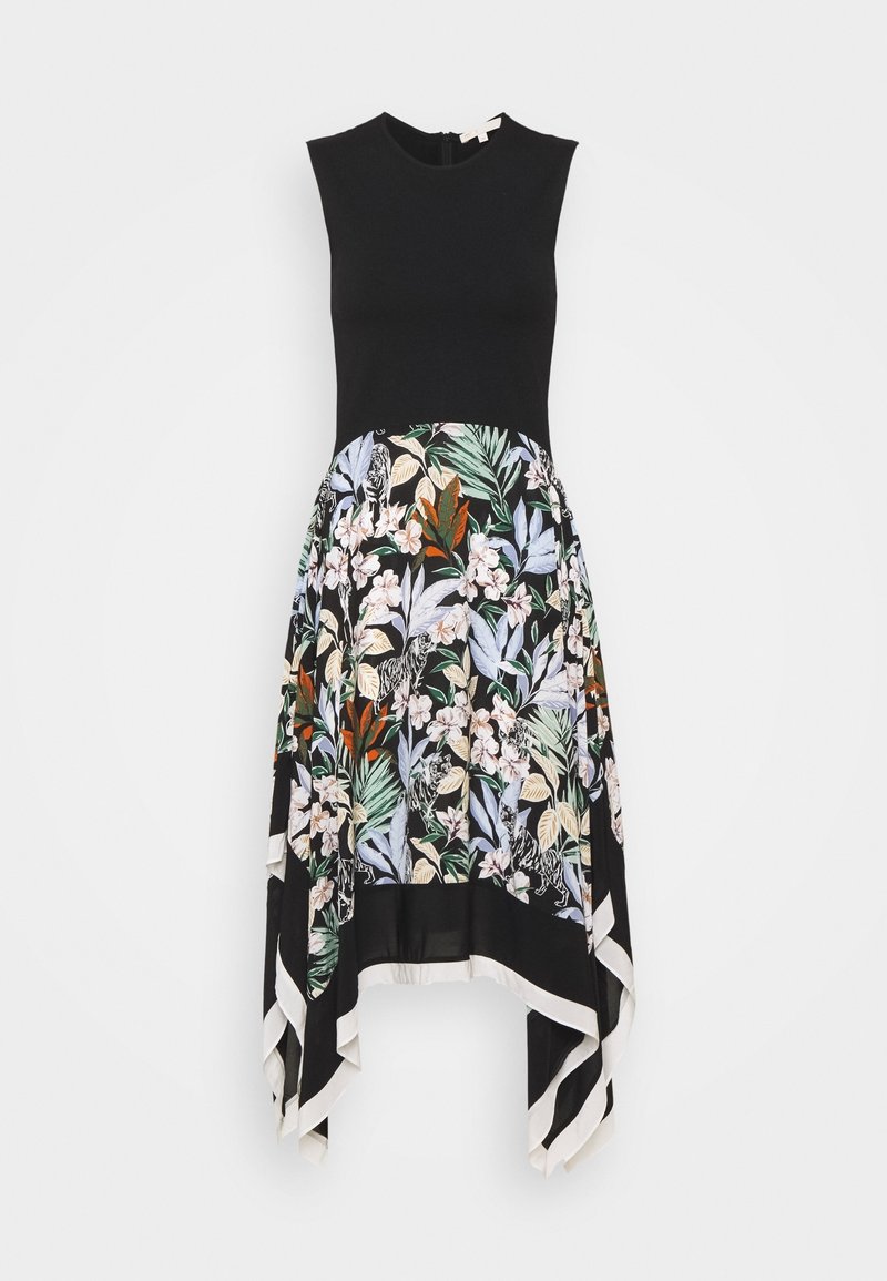 Robe noire sans manches avec haut ajusté et jupe fleurie asymétrique présentant des feuilles et des fleurs vertes, orange et blanches sur fond noir.