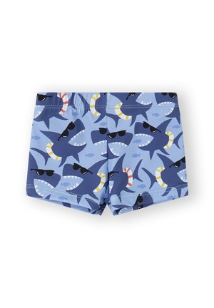 Bañadores azules con un patrón de tiburones con gafas de sol. El diseño incluye tiburones con diferentes expresiones y acentos coloridos.