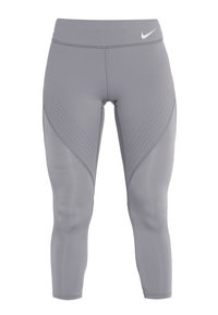 Graue Leggings aus elastischem Material mit breitem Bund, geschwungenem Paneeldesign und kleinen Perforationen an den Seiten.