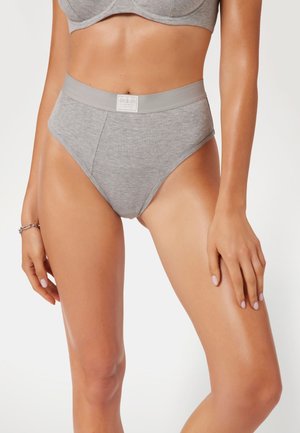 Gray high-waisted underwear with ribbed texture, elastic waistband featuring a label, and a smooth finish.