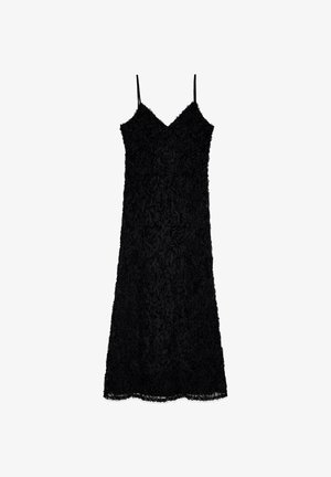 Black dress with thin straps, featuring a textured floral pattern throughout. The hemline is slightly scalloped, adding detail to the design.