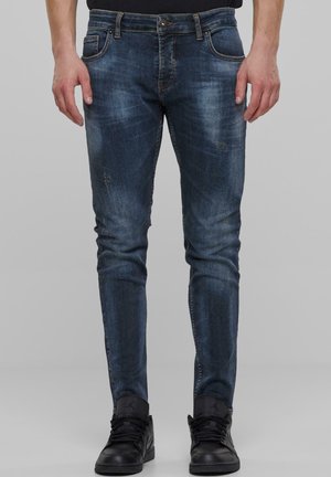 Mørkeblå jeans med slim fit, med let slitage, subtil nedslidning, klassisk femlomme-design og hardware i sølvfarve.