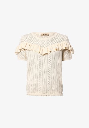 Camiseta de punto crema con un patrón de diamantes texturizado, mangas cortas y un escote con volantes. La tela presenta una textura suave y ligera.