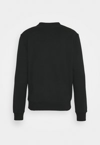 Sweat-shirt noir à manches longues avec col rond, poignets et ourlet côtelés, vu de dos sur fond blanc uni.