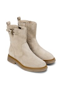 Beige suède enkellaarsjes met gestructureerde rubberen zolen, zijritsen en verstelbare banden met metalen gespen. Glad afwerking met een comfortabele voering.