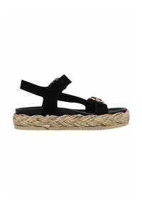 Sandalo in suede nero con due cinturini regolabili, una piattaforma in juta intrecciata e una suola in gomma per una migliore aderenza. Accentuato con dettagli in hardware dorato.
