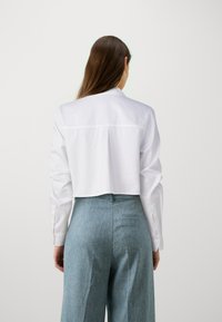 DRYKORN HALIDA - Užsagstoma palaidinė - white