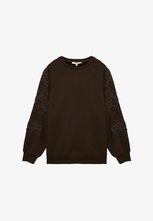 Brązowy sweatshirt z haftowanym kwiatowym wzorem na rękawach, okrągłym dekoltem i ściągaczami. Wykonany z miękkiego materiału o luźnym kroju.