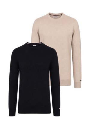 Deux pulls unis à manches longues avec col rond, un noir devant et un beige derrière, présentés sur fond blanc.