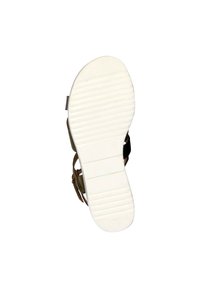 Bruine sandalen met bandjes en een textuur van witte rubberen zool. De zool heeft horizontale groeven voor grip en een afgeronde neusdesign.